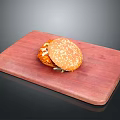 Delicious Juicy Hamburger With Sesame Seed Bun On Wooden Cutting Board