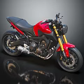 Sleek Red and Black Sport Motorcycle with Black Seat Gold Forks and Silver Exhaust