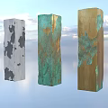 Art Installation Featuring Three Columns Gray Green Gold Patched Textures Against Blue Sky Sunset