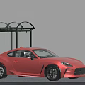 Red Two Door Sports Car With Streamlined Design And Black Wheels Near Shelter