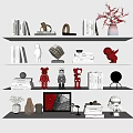 Decorative Ornament Collection with Books Sculptures Vases and Red Figurines on Shelves
