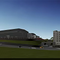 Modern Industrial Factory Building With Red Gate Green Lawn Road Pedestrians And Blue Sky