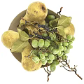 White Bowl Filled With Fresh Green Grapes And Yellow Pears With Leaves