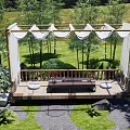 Courtyard Garden Design With Wooden Deck Canopy Curtains Surrounding Trees Grass And Stone Path