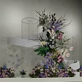 Decorative Floral Installation With Transparent Cylindrical Stands And Purple Pink White Flowers