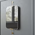 Oval Mirror with Gold Hooks Mounted on Gray Wall Reflecting Outdoor Trees and Potted Plant
