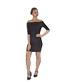 Woman In Off The Shoulder Black Dress Standing With High Heels On Gray Background