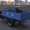 Blue Three Wheel Motorcycle With Open Cargo Bed Railings Headlights And Driver Seat