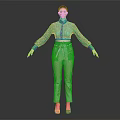 Woman in Green Lace Top and White Pants Standing Against Dark Background