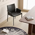Modern Black Leather Dining Chair With Wooden Table And Books In Home Interior