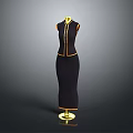 Stylish Black Women's Dress With Gold Trim And Accents On Gold Display Stand