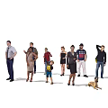 Diverse Group of People With Dog Posing Together in Casual and Formal Attire