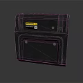 Black Industrial Equipment With Yellow Warning Label And Rugged Square Design