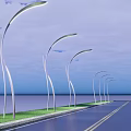 Row of Modern Curved Outdoor Lights Illuminating Roadside By Waterfront With Grass