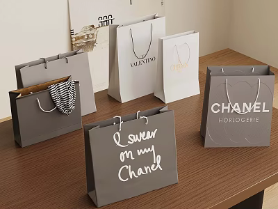 Luxury Shopping Bags With Valentino Chanel Branded Designs On Wooden Table 3d model