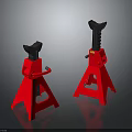 Pair Of Red Jack Stands With Black Top And Tripod Base On Dark Reflective Surface
