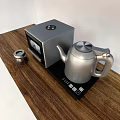 Stylish Kitchen Countertop With Silver Electric Kettle Coffee Maker And Glass Jar