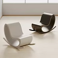 Modern White And Black Rocking Chairs With Minimalist Design On Light Wooden Floor