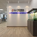 Public Office Space Interior with Company Logo Fish Tank Desks Chairs and Wooden Flooring