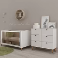 Cozy Baby Room Interior With White Chair Round Shelf Wooden Crib Dresser And Green Rug