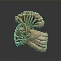 Shell Shaped Ornate Household Item With Golden Accents And Pearl Details