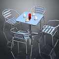 Modern Metal Outdoor Table Set With Four Striped Chairs Red Cups And White Saucers