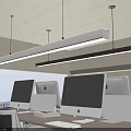 Linear Pendant Lights Over Modern Office Workspace With Computers City View And Wooden Desk