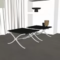 Two Modern Black Stools With Silver Metal Frame In Sleek Contemporary Room