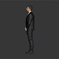 Professional Man in Black Suit White Shirt and Tie Standing Against Gray Background