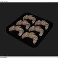 Freshly Baked Golden Flaky Croissants Arranged In Black Tray For Breakfast