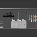 Hermes Paris Display Case With Colored Items White Shelves And Chairs