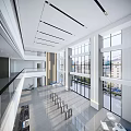 Modern Front Desk Reception Area With Spacious Lobby High Ceiling Glass Railings And Natural Light