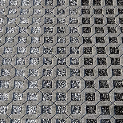 Road Infrastructure Featuring Grid Pattern Concrete Bricks On Urban Road Surface 3d model