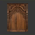Antique Wooden Cabinet With Intricate Carved Details And Double Doors