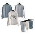 Stylish NYC Printed Sweatshirts in White Gray and Striped Hanging on Hangers