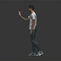 A Man Wearing White T-shirt And Green Graffiti Jeans Holding Phone Against Black Background