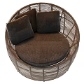 Round Rattan Outdoor Sofa With Dark Cushions And Light Brown Seat Design