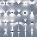 Illuminated Wall Lamps With Various Styles And Projected Light Effects On Black Background