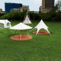 Scenic Outdoor Tents Arranged On Green Lawn With City Skyline Background