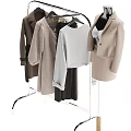 Standing Metal Clothes Hanger With Coats Sweaters Pants And Mannequin In Beige Outfit