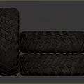 Stacked Heavy Duty Tires With Deep Tread And Silver Metallic Rims