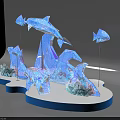 Vibrant Blue Dolphin And Fish 3D Sculptures With White Decorations On Wavy Blue Base