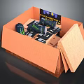 Open Orange Snack Box With Monster Energy Drinks Snacks And Strangeways Card