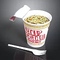 Cup Noodles With Open Lid Showing Noodles Inside And White Fork Beside