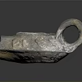 Handcrafted Rustic Metal Sculpture Featuring Curved Handle Central Hole And Textured Surface