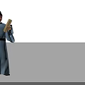 Man in Traditional Attire Wearing Black Hat and Light Blue Robe Holding Scroll