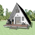A Frame Cabin Building With Glass Door Wooden Deck Grill Outdoor Seating Surrounded By Trees