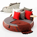 Round Single Seater Sofa With Red Black Woven Design Gray Cushion Pillows And Throw Blanket