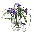 Transparent Glass Vase With Purple Flowers Green Leaves Water And Small Bottle