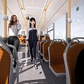 People Walking Inside Bus With Orange Seats And Bright Windows 3d model